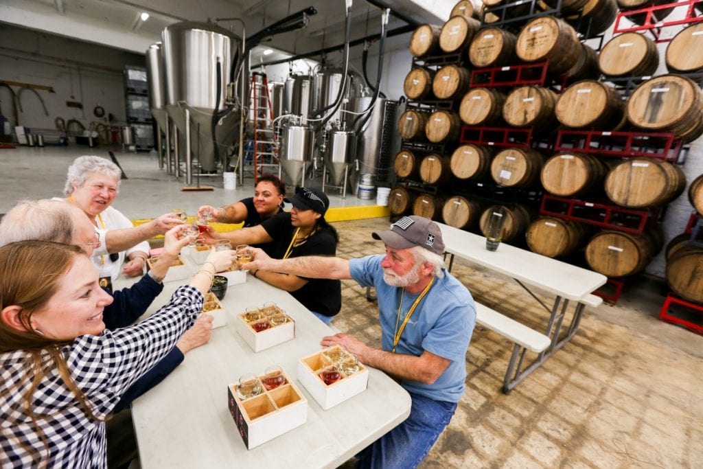 A Baltimore Brew Tours group toasts with their mead tastings at Charm City Meadworks