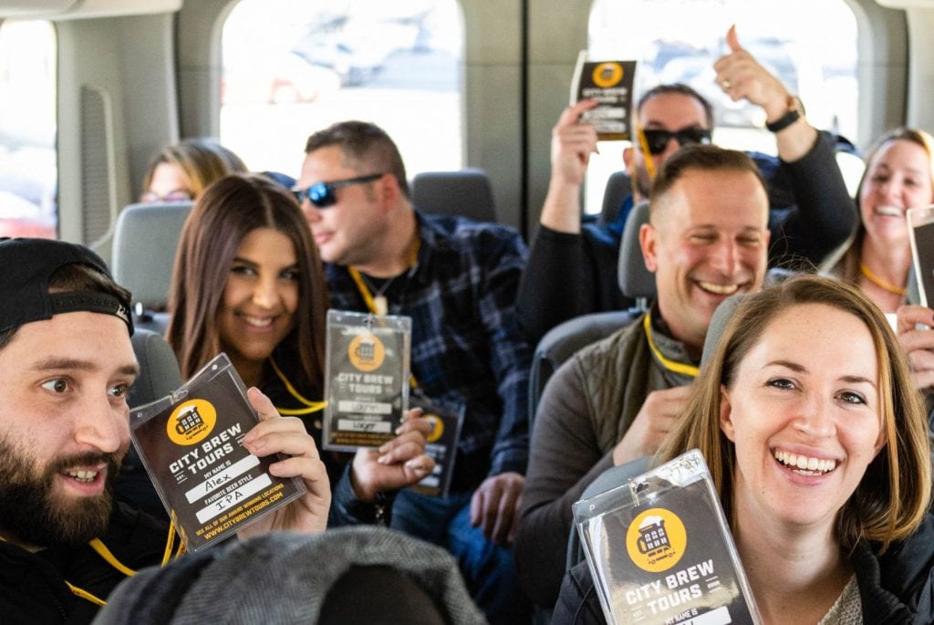 Tour guests ready to go inside the City Brew Tours van