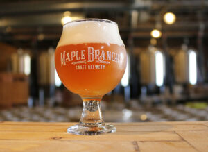 Maple Branch Brewery with beer glass on the Bar