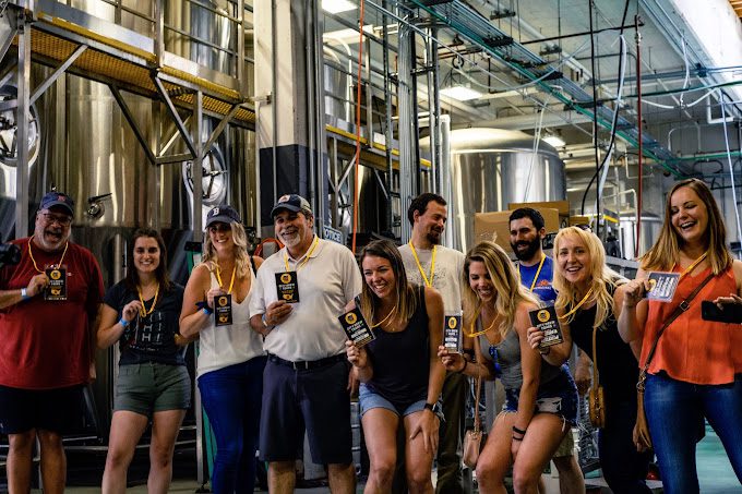A group of people who took our Montreal tour, in a brewery
