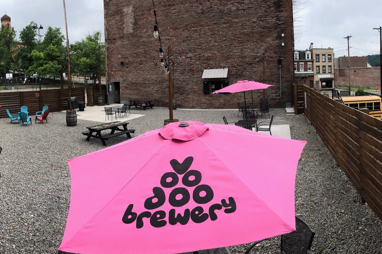 Voodoo Brewing's biergarden with hot pink umbrellas.