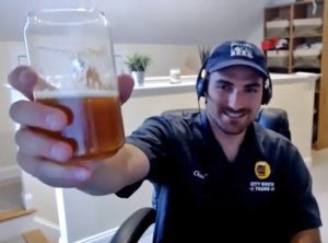 guy holding beer to camera