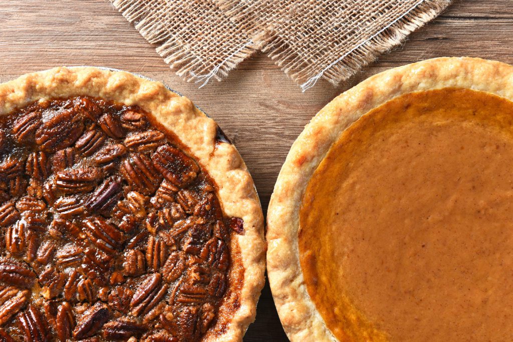 Closeup of two pies on a Thanksgiving holiday table.